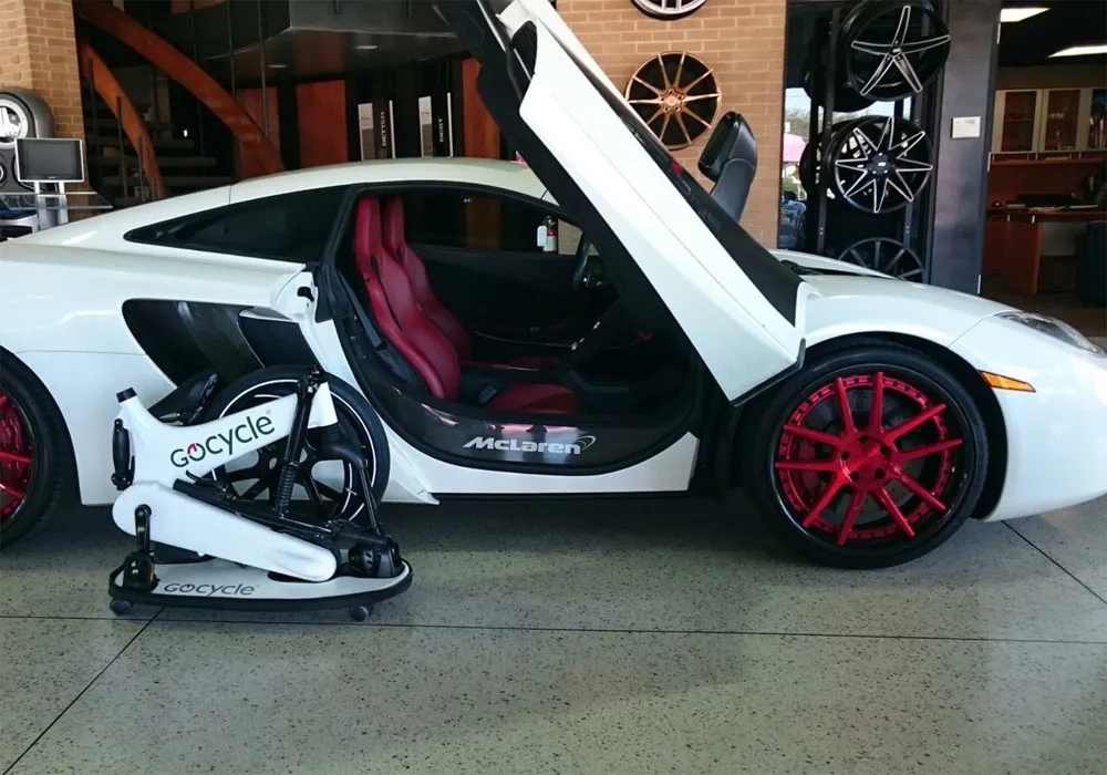 Gocycle alongside Mclaren car
